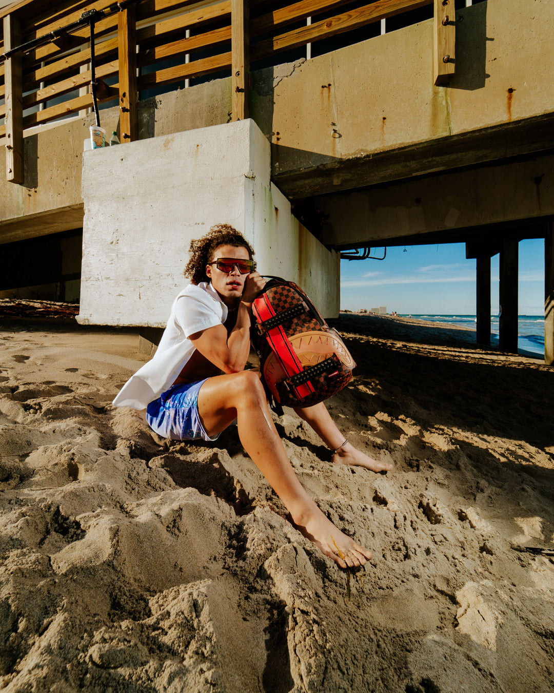 HENNY VICTORY LAP SKATEBOARD-STRAP BACKPACK
